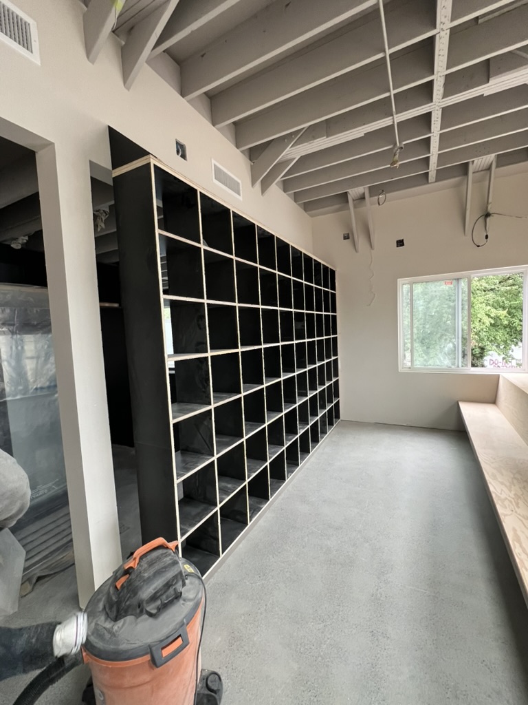 Custom bookshelf millwork at New Brewing East Vancouver