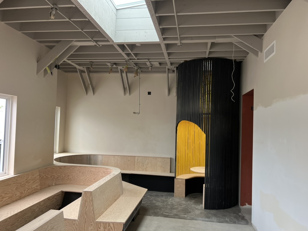 Curved millwork section and tree feature at New Brewing East Vancouver