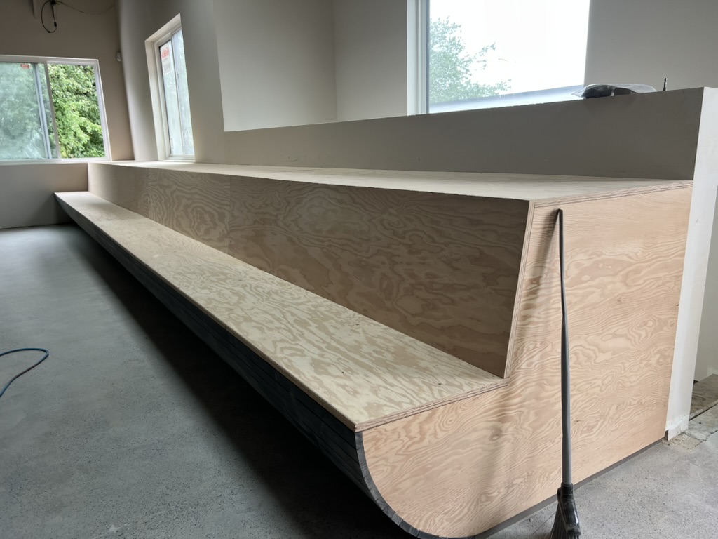 Custom-built wood benches at New Brewing East Vancouver taproom
