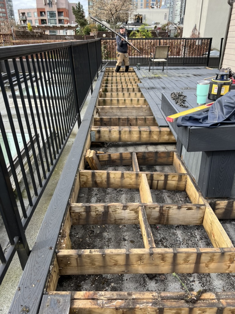 Demolition of an old rooftop deck in Yaletown, Vancouver